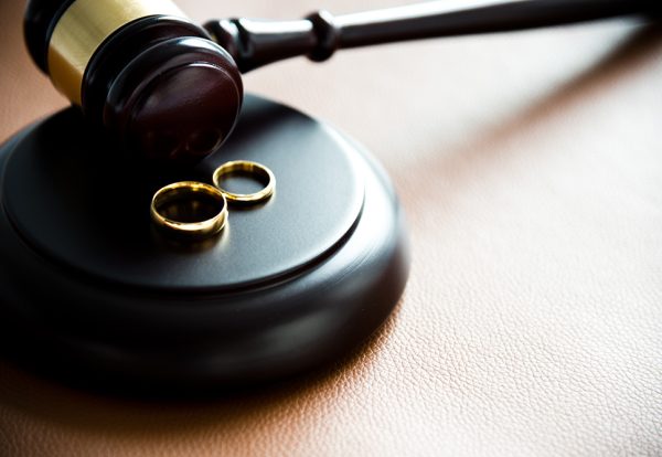 Gavel and wedding rings, for divorce concept.